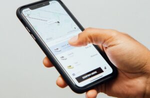 A man calls a taxi using a mobile app